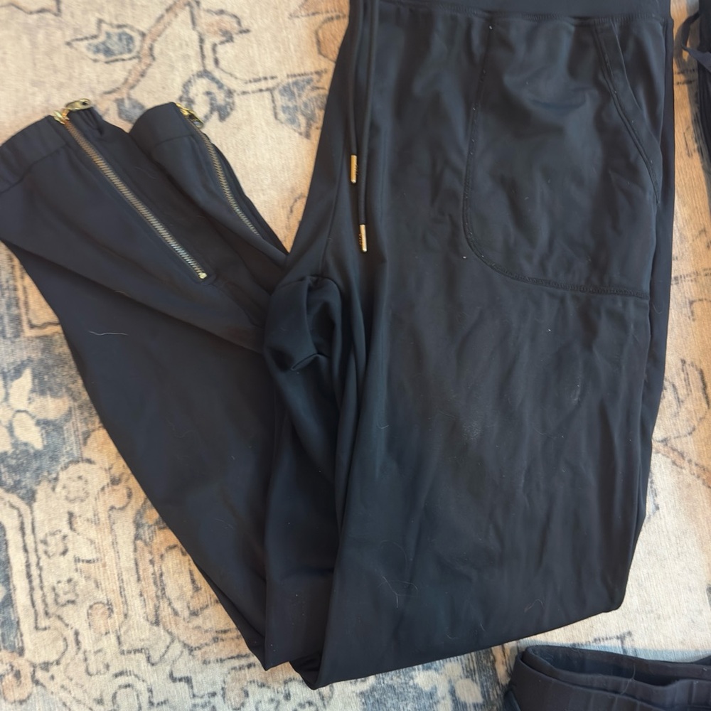 Chic Black Peak Joggers with Gold Zipper Details